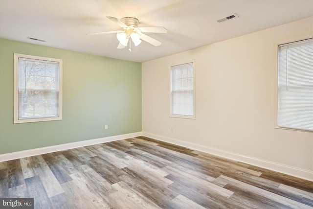 unfurnished room featuring hardwood / wood-style flooring and ceiling fan