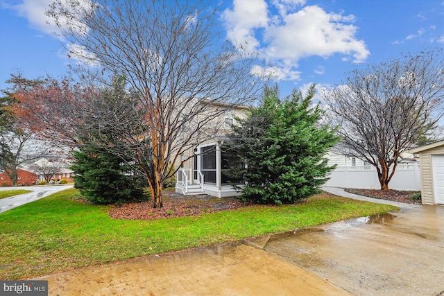 view of side of home featuring a lawn