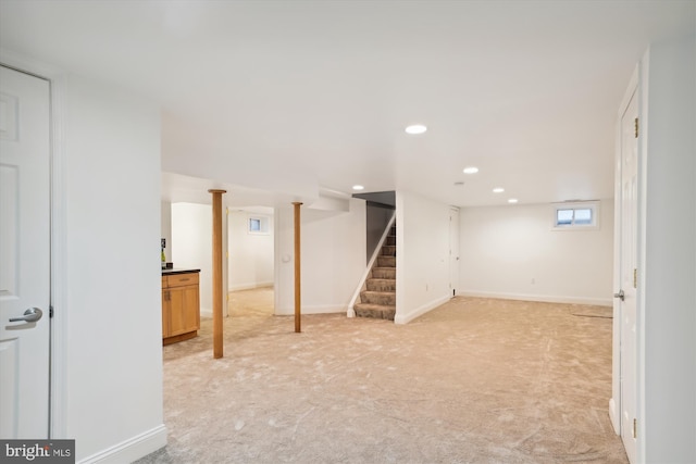 basement with light colored carpet