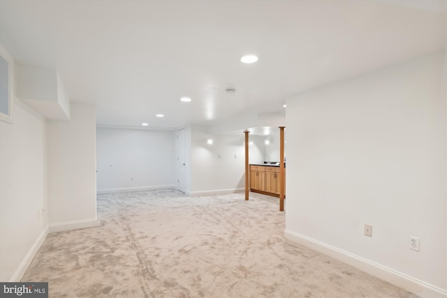 empty room with light colored carpet