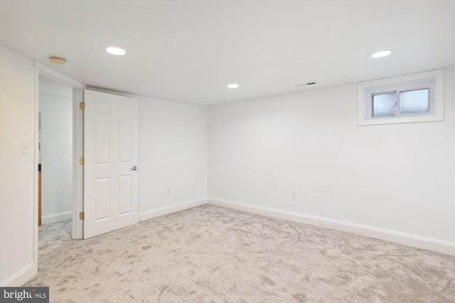 basement with light colored carpet