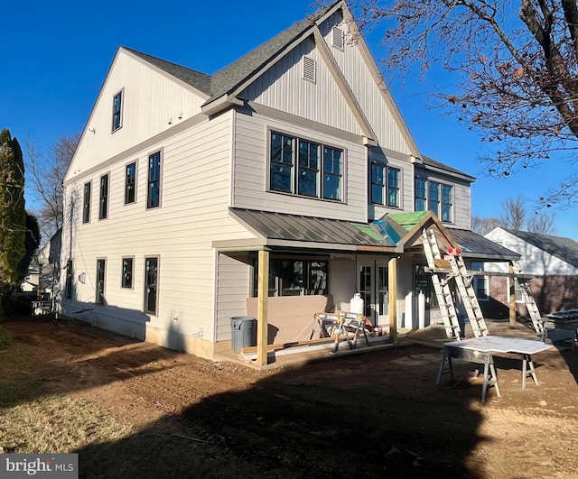 rear view of property featuring a patio