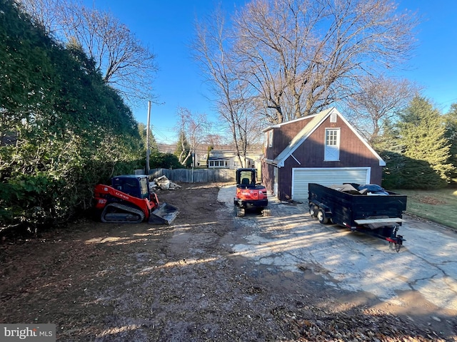 view of parking / parking lot with a garage