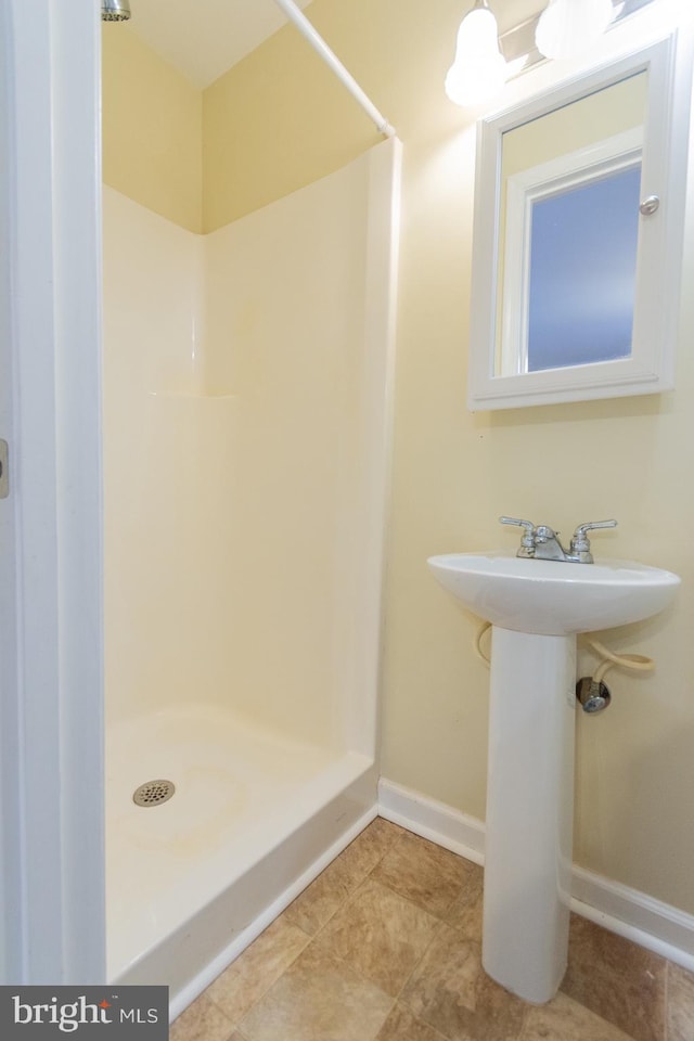 bathroom featuring walk in shower