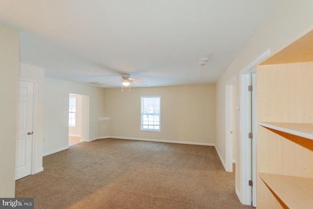 carpeted empty room with ceiling fan