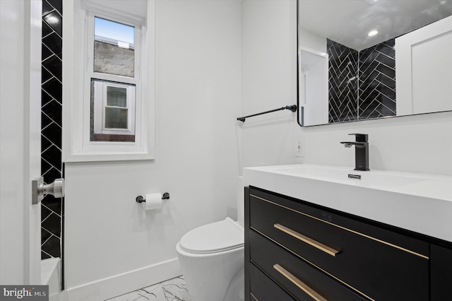 bathroom with vanity and toilet