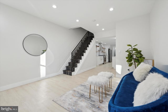 sitting room with light hardwood / wood-style flooring