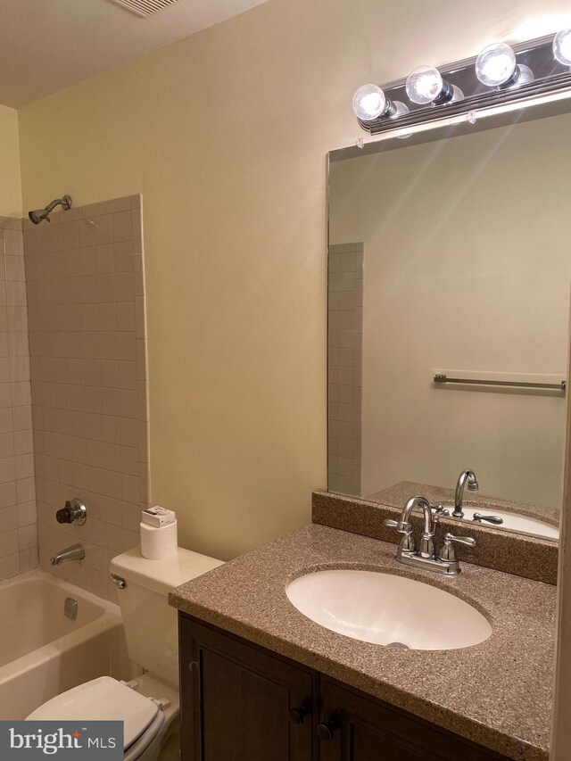 full bathroom with vanity, toilet, and shower / washtub combination