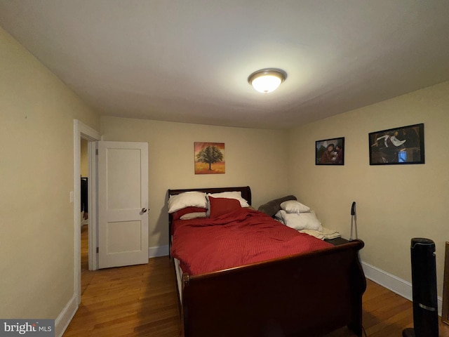 bedroom with wood-type flooring