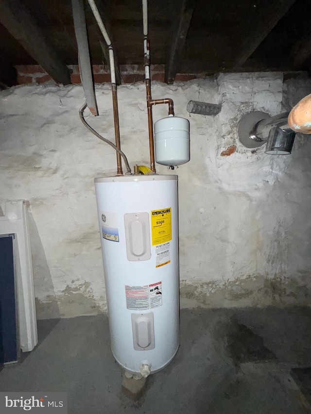 utility room with electric water heater