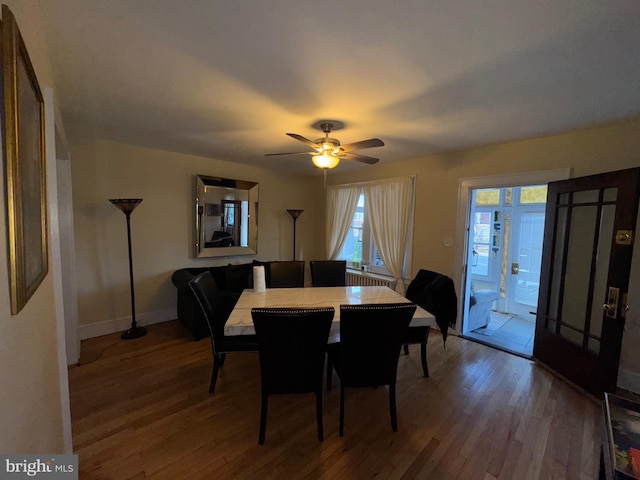 dining space featuring hardwood / wood-style flooring and ceiling fan