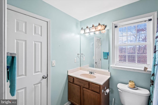 bathroom featuring vanity and toilet