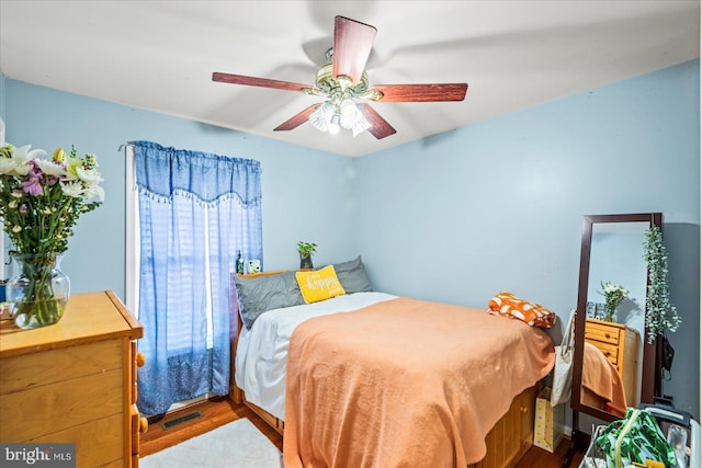 bedroom with ceiling fan and light hardwood / wood-style floors