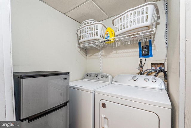 laundry room featuring washing machine and clothes dryer