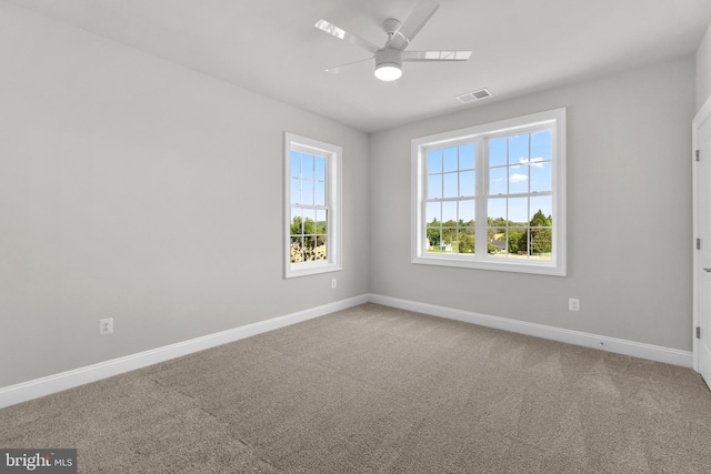 carpeted empty room with ceiling fan