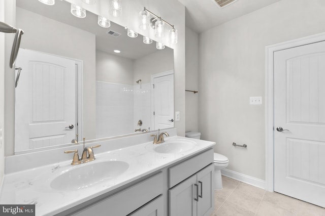 bathroom with walk in shower, tile patterned flooring, vanity, and toilet