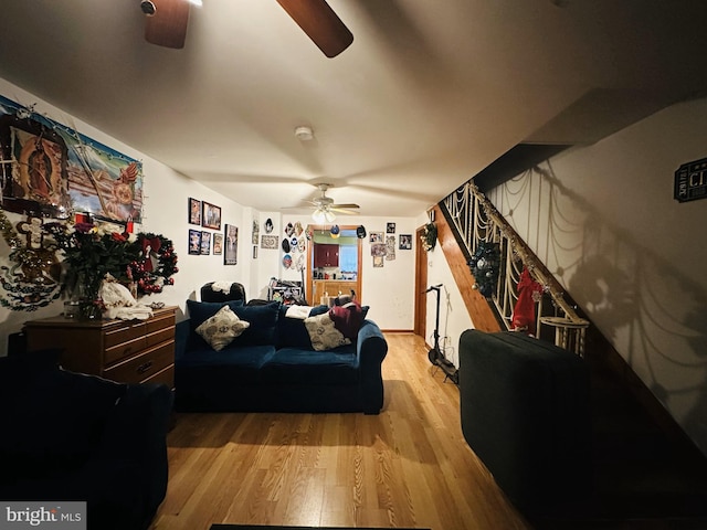 bedroom with ceiling fan and light hardwood / wood-style floors