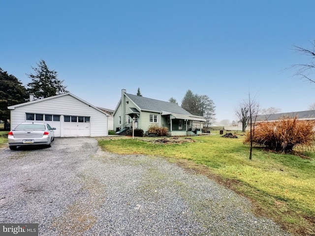 view of front of home featuring a garage and a front lawn