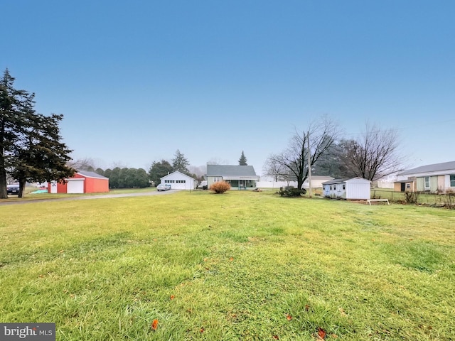 view of yard with a storage unit