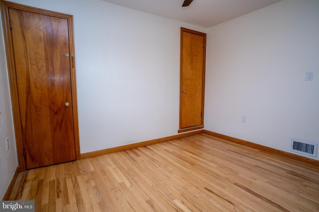 spare room featuring light hardwood / wood-style floors