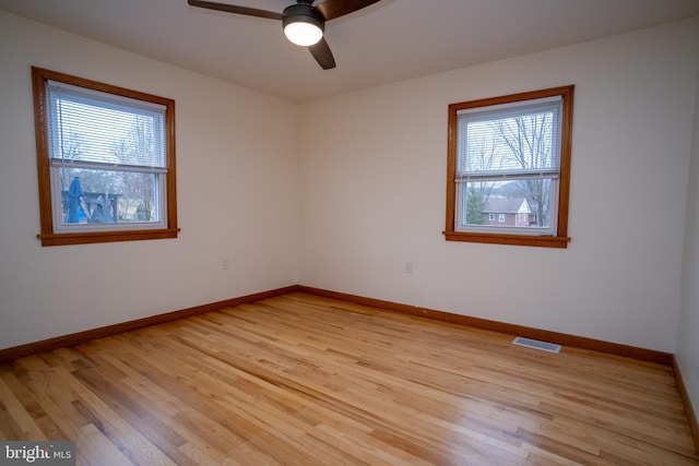 unfurnished room featuring light wood-type flooring and ceiling fan