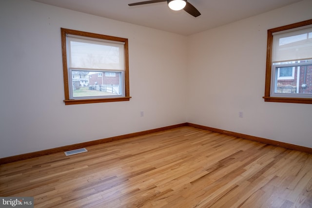 spare room featuring ceiling fan and light wood-type flooring