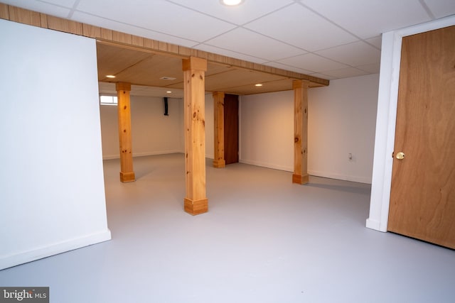 basement featuring a paneled ceiling