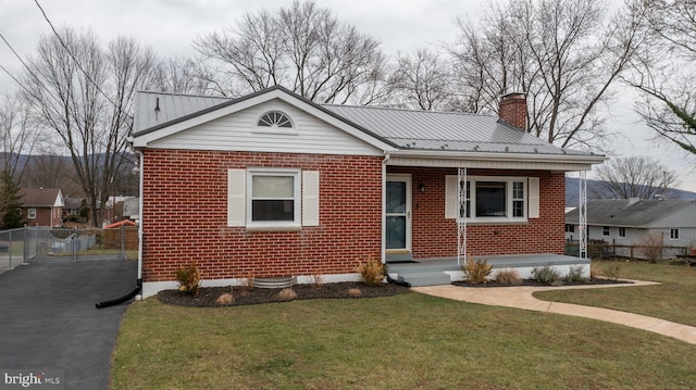 bungalow with a front yard