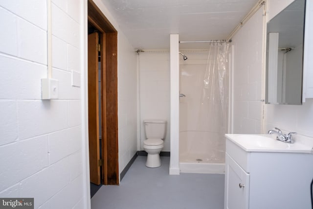 bathroom with a shower with shower curtain, vanity, toilet, and concrete flooring