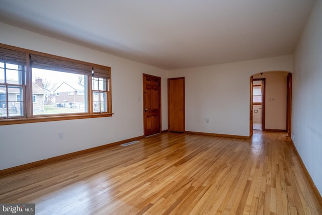 spare room with light hardwood / wood-style flooring