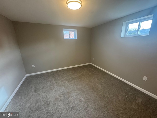 basement featuring carpet flooring and plenty of natural light