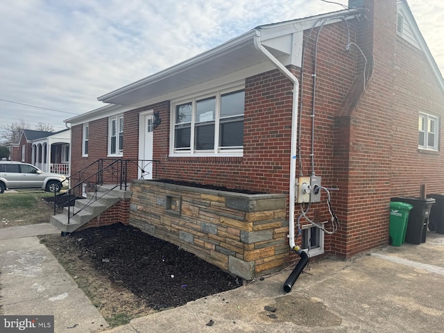 2215 Iverson St, Temple Hills, MD 20748 - view of front facade featuring brick siding and a chimney
