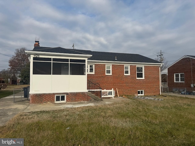 2215 Iverson St, Temple Hills, MD 20748 - rear view of house with a chimney, a sunroom, and roof with shingles