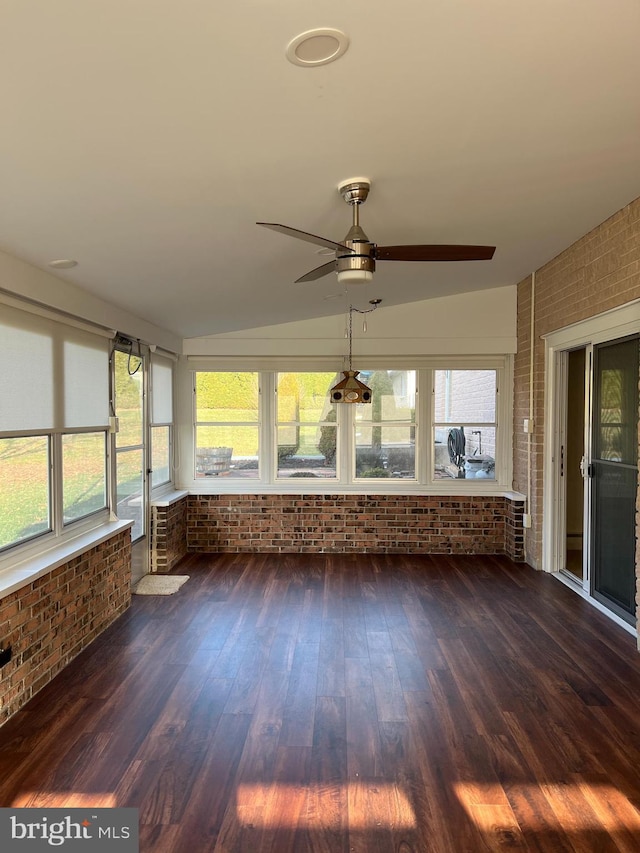 unfurnished sunroom featuring ceiling fan and lofted ceiling