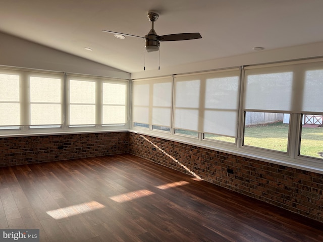 unfurnished sunroom with ceiling fan