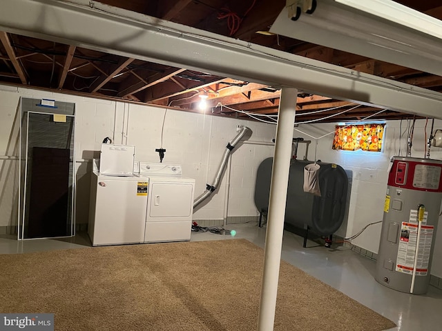 basement featuring water heater and washer and clothes dryer