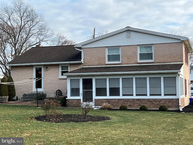 view of front of property with a front lawn