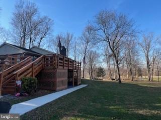 view of yard with a wooden deck