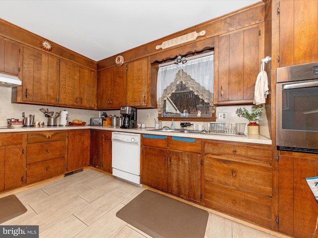 kitchen featuring dishwasher and stainless steel oven