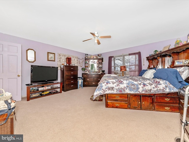 bedroom with ceiling fan and carpet