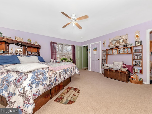 bedroom featuring ceiling fan and light carpet