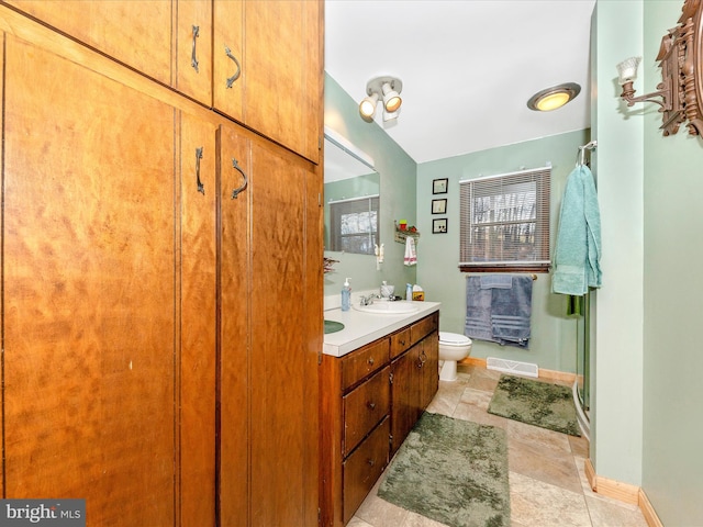 bathroom with vanity and toilet