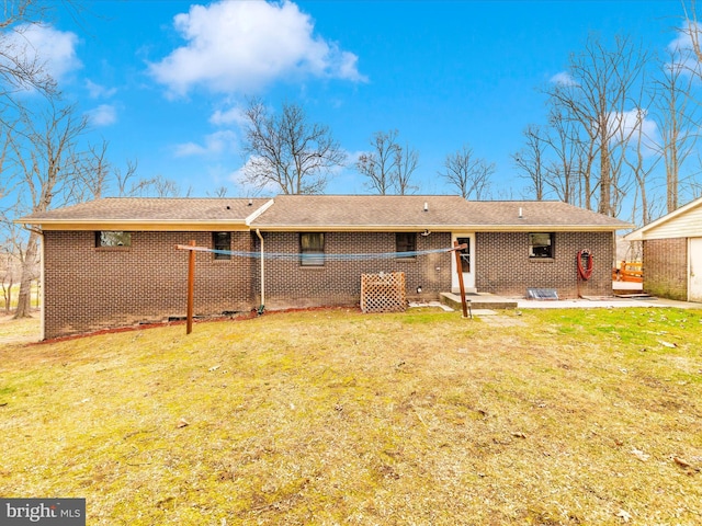 rear view of house with a yard