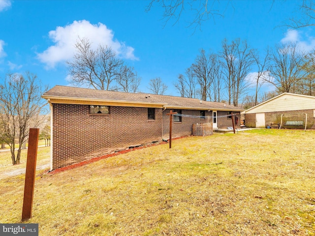 rear view of house with a lawn