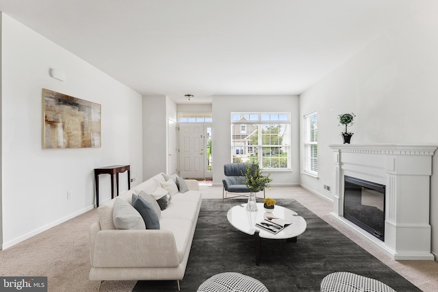 living room featuring light carpet