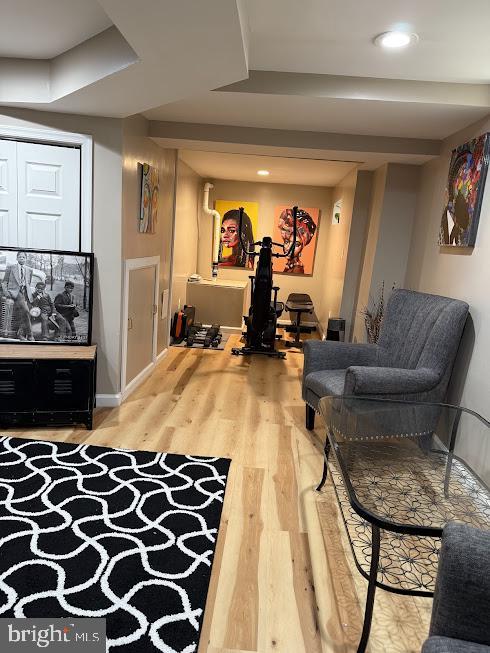 living area with hardwood / wood-style floors