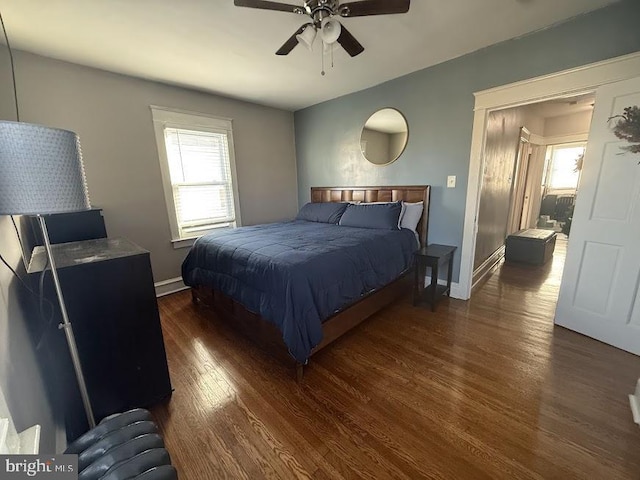 bedroom featuring dark hardwood / wood-style flooring and ceiling fan