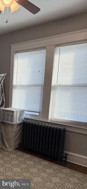 interior space featuring ceiling fan and radiator