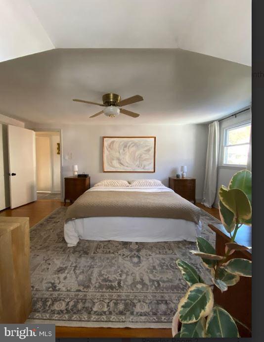 bedroom with ceiling fan and hardwood / wood-style floors