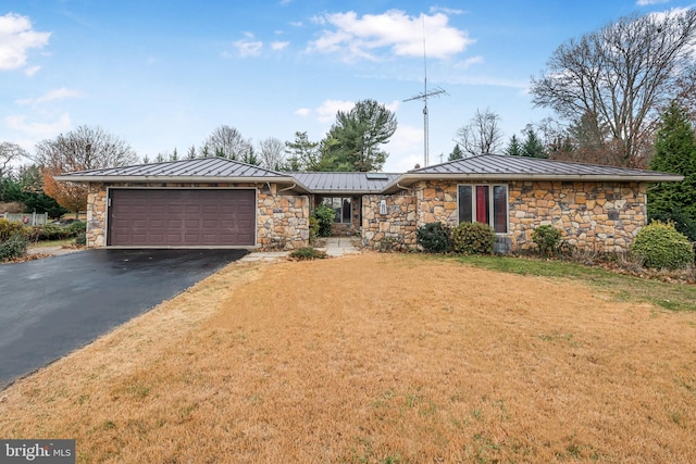 ranch-style home with a garage